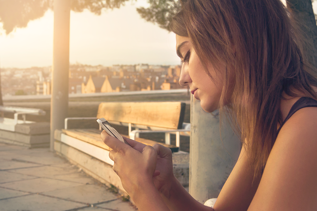 mobile photography hands holding smartphone outdoors natural light